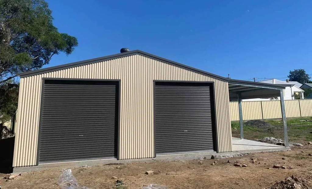 Metal backyard storage shed with two dark roller doors
